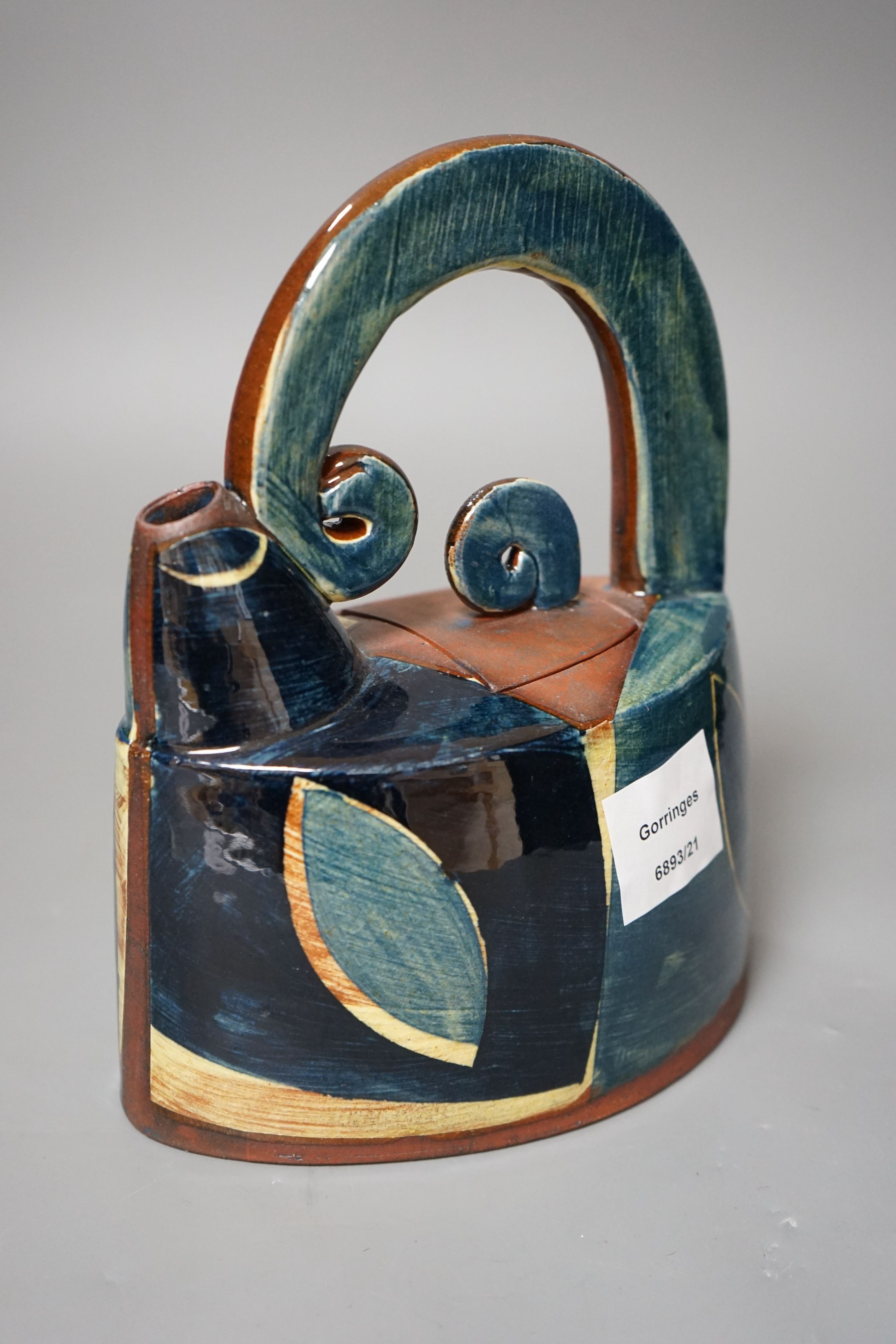 Richard Phethean (b.1953), an abstract green yellow and blue glazed earthenware teapot, purchased from Craft Potters Association contemporary ceramics centre, 63 Great Russell Street, London, 23cm tall